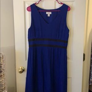 Sleeveless blue and black empire waist dress